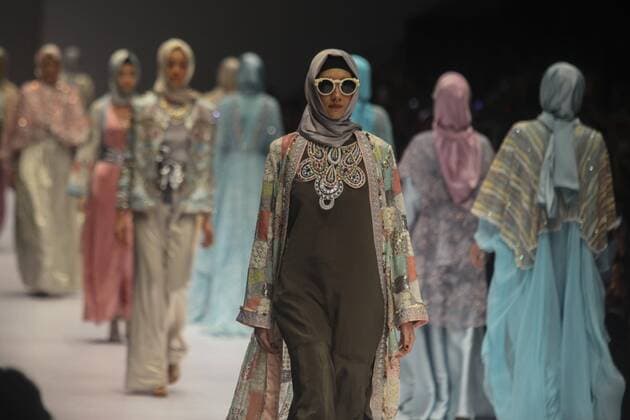 October 28, 2016 - Jakarta, Jakarta, Indonesia - A model walks on the runway to present Indonesian Muslim designer, Anniesa Hasibuan during the Jakarta Fashion Week in Jakarta, Indonesia, on October 28, 2016. Anniesa Hasibuan, 30, has made history by presenting the first ever collection at New York Fashion Week (NYFW) last month to feature hijabs in every look. She also the first Indonesian to have a show at an official NYFW venue. Her collection, called D Jakarta, featured headscarves in gold, silver and pink, metallic silver and gold long skirts, beaded shiny jackets and silky pants. Jakarta Indonesia - ZUMAn230 20161028_zaa_n230_314