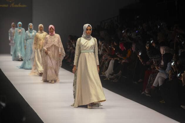 October 28, 2016 - Jakarta, Jakarta, Indonesia - A model walks on the runway to present Indonesian Muslim designer, Anniesa Hasibuan during the Jakarta Fashion Week in Jakarta, Indonesia, on October 28, 2016. Anniesa Hasibuan, 30, has made history by presenting the first ever collection at New York Fashion Week (NYFW) last month to feature hijabs in every look. She also the first Indonesian to have a show at an official NYFW venue. Her collection, called D Jakarta, featured headscarves in gold, silver and pink, metallic silver and gold long skirts, beaded shiny jackets and silky pants. Jakarta Indonesia - ZUMAn230 20161028_zaa_n230_318