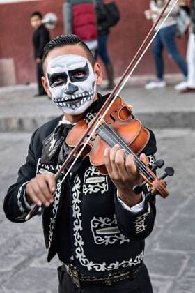 October 28, 2016 - San Miguel De Allende, Guanajuato, Mexico - A mariachi dressed as a skeleton for the Day of the Dead festival performs in the Jardin Principal October 28, 2016 in San Miguel de Allende, Guanajuato, Mexico. The week-long celebration is a time when Mexicans welcome the dead back to earth for a visit and celebrate life. San Miguel De Allende Mexico - ZUMAe02_ 20161028_zaf_e02_014