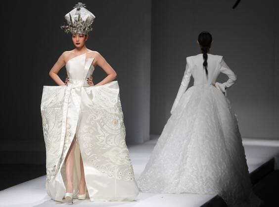 Chinese and European models wear clothing from the Maryma 2017 collection during China s international fashion week in Beijing on October 29, 2016. Chinese fashion designers are becoming an international force with both European and American fashion houses looking at the new, fresh Chinese clothing-minds as potential partners in future clothing brands.  PEK2016102920 STEPHENxSHAVER