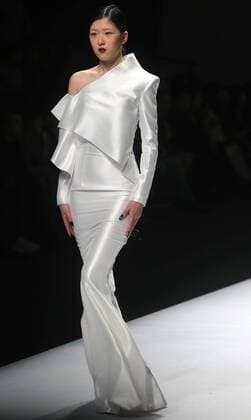 Chinese and European models wear clothing from the Maryma 2017 collection during China s international fashion week in Beijing on October 29, 2016. Chinese fashion designers are becoming an international force with both European and American fashion houses looking at the new, fresh Chinese clothing-minds as potential partners in future clothing brands.  PEK2016102914 STEPHENxSHAVER