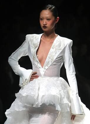Chinese and European models wear clothing from the Maryma 2017 collection during China s international fashion week in Beijing on October 29, 2016. Chinese fashion designers are becoming an international force with both European and American fashion houses looking at the new, fresh Chinese clothing-minds as potential partners in future clothing brands.  PEK2016102919 STEPHENxSHAVER