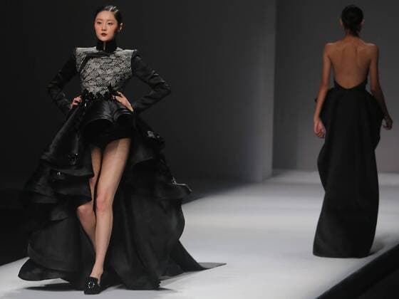 Chinese and European models wear clothing from the Maryma 2017 collection during China s international fashion week in Beijing on October 29, 2016. Chinese fashion designers are becoming an international force with both European and American fashion houses looking at the new, fresh Chinese clothing-minds as potential partners in future clothing brands.  PEK2016102933 STEPHENxSHAVER