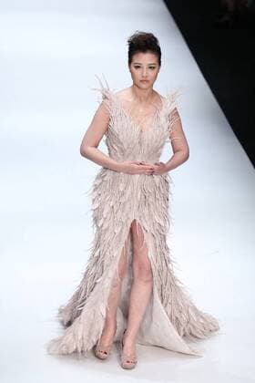 BEIJING, CHINA - OCTOBER 29: Actress Kathy Chow showcases designs on the runway at Jusere collection during the Mercedes-Benz China Fashion Week Spring Summer 2017 at 751D Park on October 29, 2016 in Beijing, China.  CFP494621762