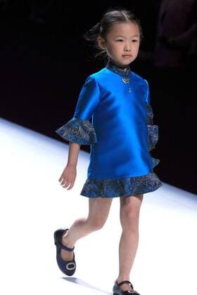 A child model presents a parent-child outfit by designer Amelie Wang during the China Fashion Week in Beijing, capital of China, Oct. 30, 2016. ) (wsw) CHINA-BEIJING-FASHION WEEK (CN) LixMingfang 