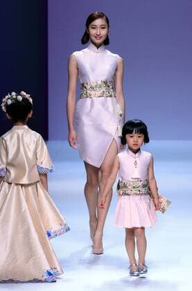 Models present parent-child outfits by designer Amelie Wang during the China Fashion Week in Beijing, capital of China, Oct. 30, 2016. ) (wsw) CHINA-BEIJING-FASHION WEEK (CN) LixMingfang 