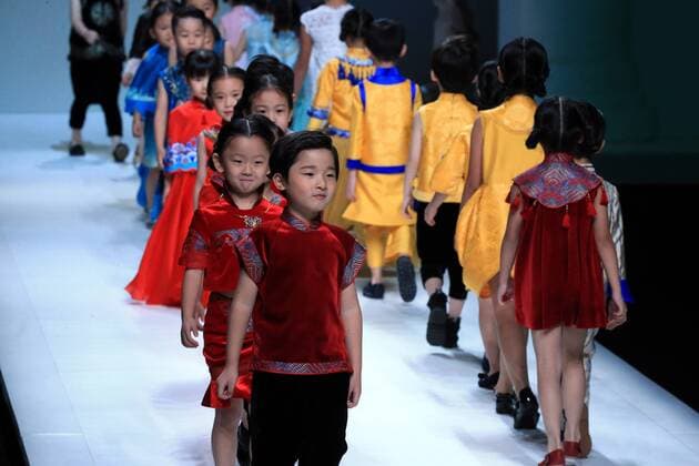 Children models present parent-child outfits by designer Amelie Wang during the China Fashion Week in Beijing, capital of China, Oct. 30, 2016. ) (wsw) CHINA-BEIJING-FASHION WEEK (CN) LixMingfang 