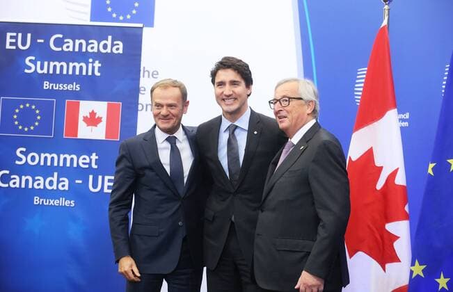European Council President Donald Tusk, Canadian Prime Minister Justin Trudeau and European Commission President Jean-Claude Juncker arrive at the EU-Canada summit meeting, Sunday 30 October 2016, at the European Union headquarters in Brussels. EU leaders and Canada will sign at Today s summit the Comprehensive Economic and Trade Agreement (CETA). The signing of the treaty was delayed by the refusal of the Belgian Walloon and Brussels Region.  NICOLASxMAETERLINCK 04969007
