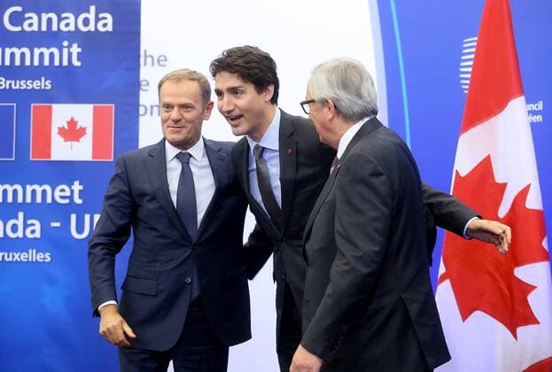 European Council President Donald Tusk, Canadian Prime Minister Justin Trudeau and European Commission President Jean-Claude Juncker pictured during the EU-Canada summit meeting, Sunday 30 October 2016, at the European Union headquarters in Brussels. EU leaders and Canada will sign at Today s summit the Comprehensive Economic and Trade Agreement (CETA). The signing of the treaty was delayed by the refusal of the Belgian Walloon and Brussels Region.  NICOLASxMAETERLINCK 04969047