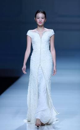 BEIJING, CHINA - OCTOBER 30: A model showcases designs on the runway at Snow Lotus collection by Tanya Wang during the Mercedes-Benz China Fashion Week Spring Summer 2017 at Banquet Hall of Beijing Hotel on October 30, 2016 in Beijing, China.  CFP494679685