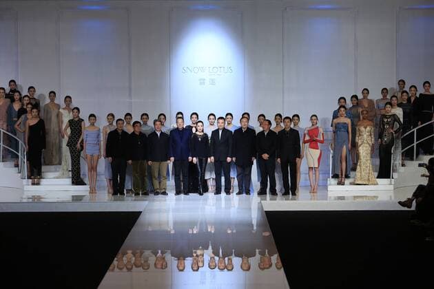 BEIJING, CHINA - OCTOBER 30: Designer Tanya Wang (woman in center) poses with guests and models on the runway at Snow Lotus collection by Tanya Wang during the Mercedes-Benz China Fashion Week Spring Summer 2017 at Banquet Hall of Beijing Hotel on October 30, 2016 in Beijing, China.  CFP494704262