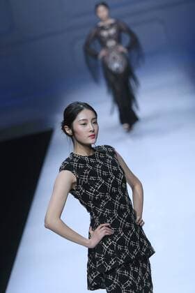 BEIJING, CHINA - OCTOBER 30: A model showcases designs on the runway at Snow Lotus collection by Tanya Wang during the Mercedes-Benz China Fashion Week Spring Summer 2017 at Banquet Hall of Beijing Hotel on October 30, 2016 in Beijing, China.  CFP494701517