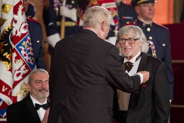 Czech President Milos Zeman, centre, bestowed state decorations on personalities, some of them in memoriam, on Friday, October 28, in Prague, Czech Republic, on the occasion of the national holiday marking the establishment of the independent Czechoslovak state in 1918. Juraj Jakubisko, right, and singer Daniel Hulka, left, receive the Medals of Merit for contribution to the state in the field of art. (CTKxPhoto VitxSimanek) CTKPhotoP201610281084901  VIS 003
