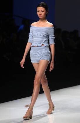 Chinese and European models wear clothing from the Lotus 2017 collection during China s international fashion week in Beijing on October 31, 2016. Chinese fashion designers are becoming an international force with both European and American fashion houses looking at the new, fresh Chinese clothing-minds as potential partners in future clothing brands.  PEK2016103115 STEPHENxSHAVER