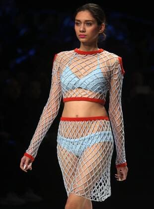 Chinese and European models wear clothing from the Lotus 2017 collection during China s international fashion week in Beijing on October 31, 2016. Chinese fashion designers are becoming an international force with both European and American fashion houses looking at the new, fresh Chinese clothing-minds as potential partners in future clothing brands.  PEK2016103117 STEPHENxSHAVER