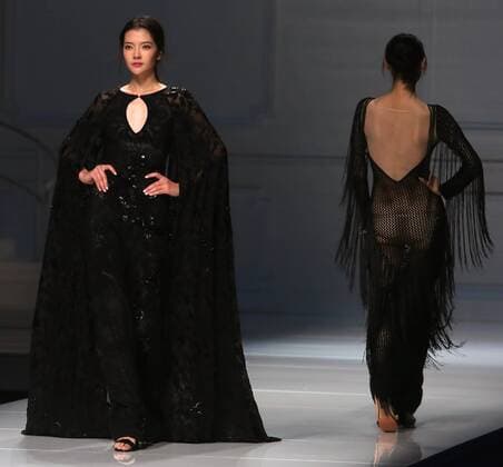 Chinese and European models wear clothing from the Lotus 2017 collection during China s international fashion week in Beijing on October 31, 2016. Chinese fashion designers are becoming an international force with both European and American fashion houses looking at the new, fresh Chinese clothing-minds as potential partners in future clothing brands.  PEK2016103132 STEPHENxSHAVER