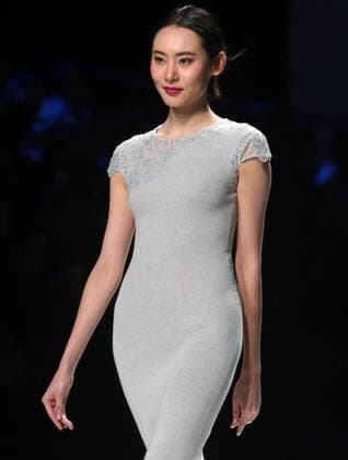 Chinese and European models wear clothing from the Lotus 2017 collection during China s international fashion week in Beijing on October 31, 2016. Chinese fashion designers are becoming an international force with both European and American fashion houses looking at the new, fresh Chinese clothing-minds as potential partners in future clothing brands.  PEK2016103101 STEPHENxSHAVER