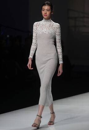 Chinese and European models wear clothing from the Lotus 2017 collection during China s international fashion week in Beijing on October 31, 2016. Chinese fashion designers are becoming an international force with both European and American fashion houses looking at the new, fresh Chinese clothing-minds as potential partners in future clothing brands.  PEK2016103102 STEPHENxSHAVER