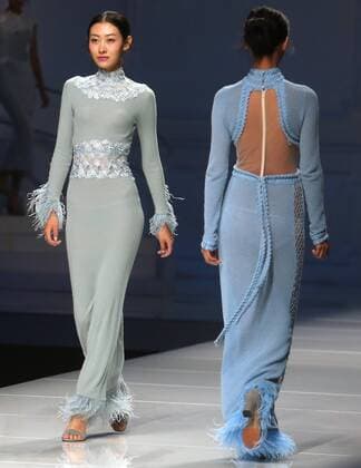 Chinese and European models wear clothing from the Lotus 2017 collection during China s international fashion week in Beijing on October 31, 2016. Chinese fashion designers are becoming an international force with both European and American fashion houses looking at the new, fresh Chinese clothing-minds as potential partners in future clothing brands.  PEK2016103108 STEPHENxSHAVER