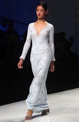 Chinese and European models wear clothing from the Lotus 2017 collection during China s international fashion week in Beijing on October 31, 2016. Chinese fashion designers are becoming an international force with both European and American fashion houses looking at the new, fresh Chinese clothing-minds as potential partners in future clothing brands.  PEK2016103111 STEPHENxSHAVER