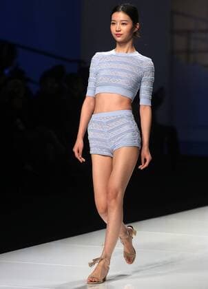 Chinese and European models wear clothing from the Lotus 2017 collection during China s international fashion week in Beijing on October 31, 2016. Chinese fashion designers are becoming an international force with both European and American fashion houses looking at the new, fresh Chinese clothing-minds as potential partners in future clothing brands.  PEK2016103112 STEPHENxSHAVER