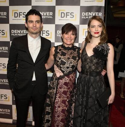 November 2, 2016 - Denver, Colorado, U.S - La La Land Director DAMIEN CHAZELLE, left, with BRITTA ERICKSON, center, of the Denver Film Society, and actress EMMA STONE, right, walk the Red Carpet to kick off the Denver Film Festivals premiere of La La Land at the Performing Arts Complex Wed. night. Denver U.S. - ZUMAav4_ 20161102_zaf_av4_009
