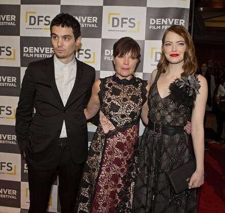 November 2, 2016 - Denver, Colorado, U.S - La La Land Director DAMIEN CHAZELLE, left, with BRITTA ERICKSON, center, of the Denver Film Society, and actress EMMA STONE, right, walk the Red Carpet to kick off the Denver Film Festivals premiere of La La Land at the Performing Arts Complex Wed. night. Denver U.S. - ZUMAav4_ 20161102_zaf_av4_001