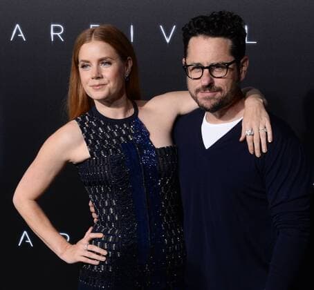 Arrival Filmpremiere in Los Angeles Cast member Amy Adams and director J.J. Abrams attend the premiere of the motion picture sci-fi thriller Arrival at the Regency Village Theatre in the Westwood section of Los Angeles on November 6, 2016. Storyline: When mysterious spacecraft touch down across the globe, an elite team - led by expert linguist Louise Banks (Amy Adams) - are brought together to investigate. As mankind teeters on the verge of global war, Banks and the team race against time for answers - and to find them, she will take a chance that could threaten her life, and quite possibly humanity.  LAP2016110622 JIMxRUYMEN