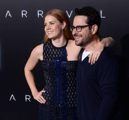 Cast member Amy Adams and director J.J. Abrams attend the premiere of the motion picture sci-fi thriller Arrival at the Regency Village Theatre in the Westwood section of Los Angeles on November 6, 2016. Storyline: When mysterious spacecraft touch down across the globe, an elite team - led by expert linguist Louise Banks (Amy Adams) - are brought together to investigate. As mankind teeters on the verge of global war, Banks and the team race against time for answers - and to find them, she will take a chance that could threaten her life, and quite possibly humanity.  LAP2016110624 JIMxRUYMEN