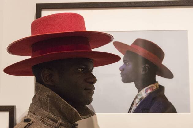 Taylor Wessing Photographic Portrait Prize 2016, National Portrait Gallery, London, UK London, UK. 16 November 2016. Abdel Queta Tavares poses in front of his portrait Abdel taken by photographer David Cantor. Press preview of the Taylor Wessing Photographic Portrait Prize 2016 at the National Portrait Gallery. The exhibition of the winning entries and shortlisted portraits runs from 17 November 2016 to 26 February 2017.