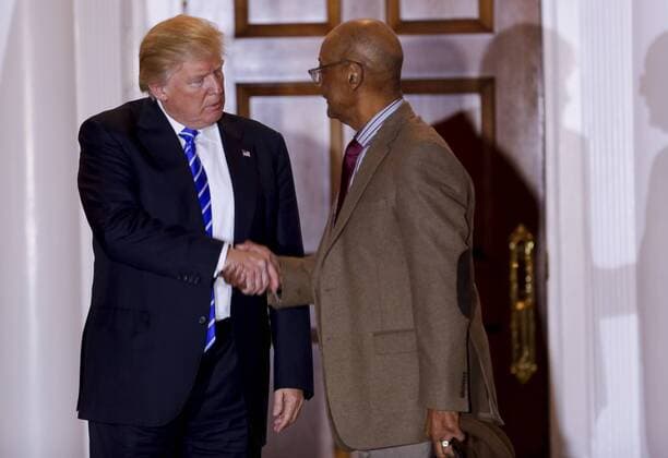 President-elect Donald Trump (L) talks shakes hands Bob Woodson at the clubhouse of Trump International Golf Club, November 19, 2016 in Bedminster Township, New Jersey. Robert L. Woodson Sr. heads the Center for Neighborhood Enterprise in Washington and advises House Speaker Paul D. Ryan (R-Wis.) on poverty issues. Pool photo by Aude Guerrucc  TPX20161119237 AUDExGUERRUCCI