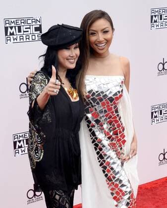 (L-R) Olivia TuTram Mai and Jeannie Mai arrive for the 2016 American Music Awards held at Microsoft Theater in Los Angeles on November 20, 2016.  LAP20161120046 JIMxRUYMEN
