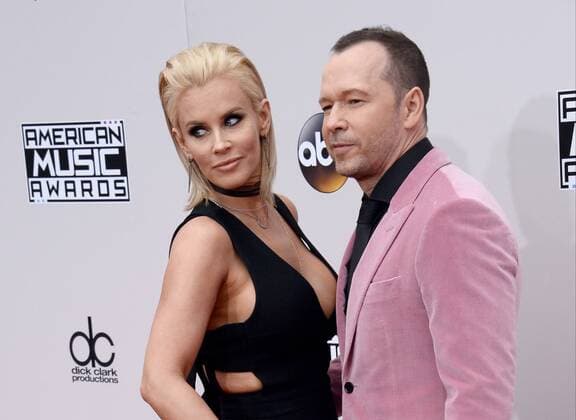 Actress Jenny McCarthy (L) and recording artist Donnie Wahlberg arrive for the 2016 American Music Awards held at Microsoft Theater in Los Angeles on November 20, 2016.  LAP20161120121 JIMxRUYMEN