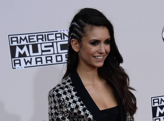 Actress Nina Dobrev arrives for the 2016 American Music Awards held at Microsoft Theater in Los Angeles on November 20, 2016.  LAP20161120293 JIMxRUYMEN