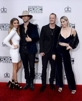Recording artists Brian Kelley (2nd from L) and Tyler Hubbard (2nd from R) of musical group Florida Georgia Line arrive for the 2016 American Music Awards held at Microsoft Theater in Los Angeles on November 20, 2016.  LAP20161120319 JIMxRUYMEN