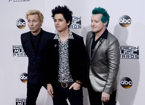 (L-R) Musicians Mike Dirnt, Billie Joe Armstrong and Tre Cool of Green Day arrive for the 2016 American Music Awards held at Microsoft Theater in Los Angeles on November 20, 2016.  LAP20161120307 JIMxRUYMEN