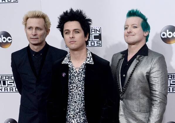 (L-R) Musicians Mike Dirnt, Billie Joe Armstrong and Tre Cool of Green Day arrive for the 2016 American Music Awards held at Microsoft Theater in Los Angeles on November 20, 2016.  LAP20161120310 JIMxRUYMEN