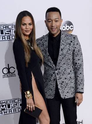 Model Chrissy Teigen (L) and singer John Legend arrive for the 2016 American Music Awards held at Microsoft Theater in Los Angeles on November 20, 2016.  LAP20161120404 JIMxRUYMEN
