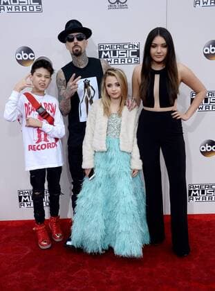 Recording artist Travis Barker arrives with his family for the 2016 American Music Awards held at Microsoft Theater in Los Angeles on November 20, 2016.  LAP20161120520 JIMxRUYMEN