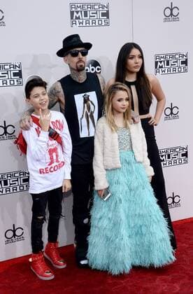 Recording artist Travis Barker arrives with his family for the 2016 American Music Awards held at Microsoft Theater in Los Angeles on November 20, 2016.  LAP20161120522 JIMxRUYMEN