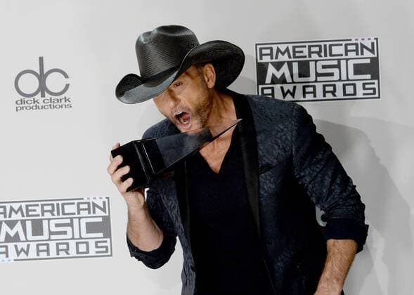 Singer-songwriter Tim McGraw appears backstage with the award for Favorite Country Song during the 2016 American Music Awards held at Microsoft Theater in Los Angeles on November 20, 2016.  LAP20161120571 JIMxRUYMEN