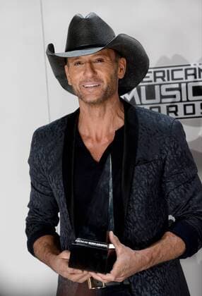 Singer-songwriter Tim McGraw appears backstage with the award for Favorite Country Song during the 2016 American Music Awards held at Microsoft Theater in Los Angeles on November 20, 2016.  LAP20161120572 JIMxRUYMEN