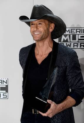 Singer-songwriter Tim McGraw appears backstage with the award for Favorite Country Song during the 2016 American Music Awards held at Microsoft Theater in Los Angeles on November 20, 2016.  LAP20161120574 JIMxRUYMEN