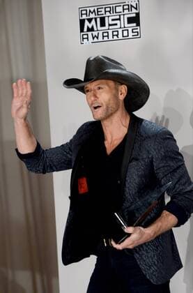Singer-songwriter Tim McGraw appears backstage with the award for Favorite Country Song during the 2016 American Music Awards held at Microsoft Theater in Los Angeles on November 20, 2016.  LAP20161120577 JIMxRUYMEN