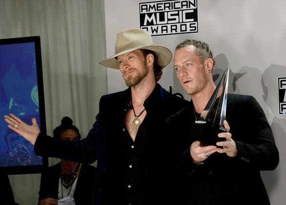 Singers Brian Kelley (L) and Tyler Hubbard of Florida Georgia Line appear backstage with the award for Favorite Country Duo or Group during the 2016 American Music Awards held at Microsoft Theater in Los Angeles on November 20, 2016.  LAP20161120585 JIMxRUYMEN