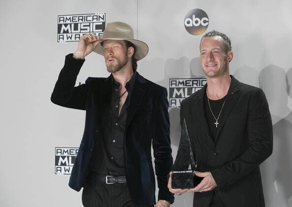 November 20, 2016 - Los Angeles, California, U.S - Brian Kelley (L) and Tyler Hubbard of musical group Florida Georgia Line pose with the Favorite Country Duo or Group award in the Press Room of the 2016 American Music Awards held on Sunday, November 20, 2016 at the Microsoft Theatre in Los Angeles, California. Los Angeles U.S. - ZUMAp124 20161120_zaa_p124_262