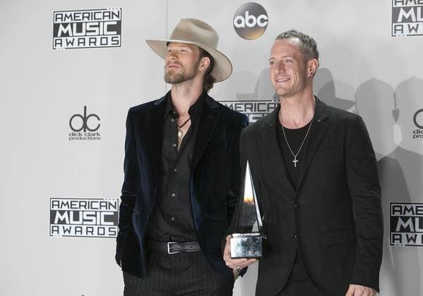 November 20, 2016 - Los Angeles, California, U.S - Brian Kelley (L) and Tyler Hubbard of musical group Florida Georgia Line pose with the Favorite Country Duo or Group award in the Press Room of the 2016 American Music Awards held on Sunday, November 20, 2016 at the Microsoft Theatre in Los Angeles, California. Los Angeles U.S. - ZUMAp124 20161120_zaa_p124_263