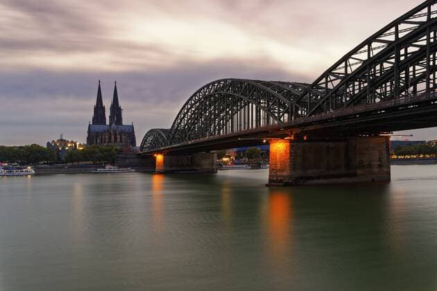 Germany, Cologne, view to Cologne Cathedral with Hohenzollern Bridge in the foreground at evening twilight  GFF00813