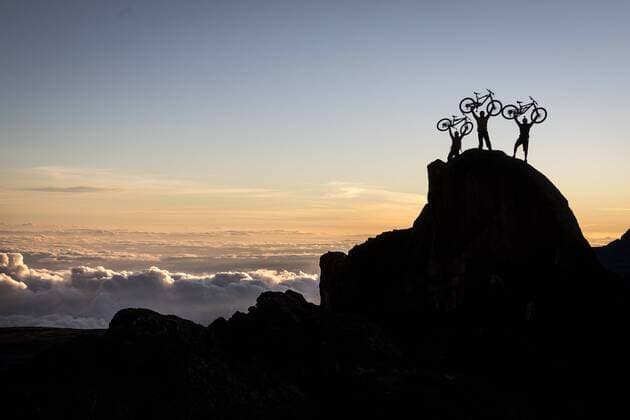 Nov 2, 2016 - Mount Kenya, Kenya - Swiss-American HANS REY, German GERHARD CZERNER and Scotman DANNY MACASKILL in silhouette lift up their bikes in the morning, the day before they summit Mount Kenya. The little peak they stand on is right next to Kibo Hut, the Basecamp of the trip on 4700m 15,400ft above sea level. Professional mountain bike riders Hans Rey, Danny MacAskill and Gerhard Czerner are the first to take on Africa s two highest mountains back to back on mountain bikes. On Oct 26th Rey and Czerner summit Africa s second tallest mountain, Mount Kenya s Point Lenana (4,985m 16,355ft) with their mountain bikes. On November 3rd, only one week later, together with urban trials YouTube sensation Danny MacAskill; they also summited Mount Kilimanjaro (5,895m 19,340ft), the Roof of Africa. There have only been a handful of people who have taken their bikes to either Mount Kilimanjaro - ZUMAb163 20161102_zpa_b163_013