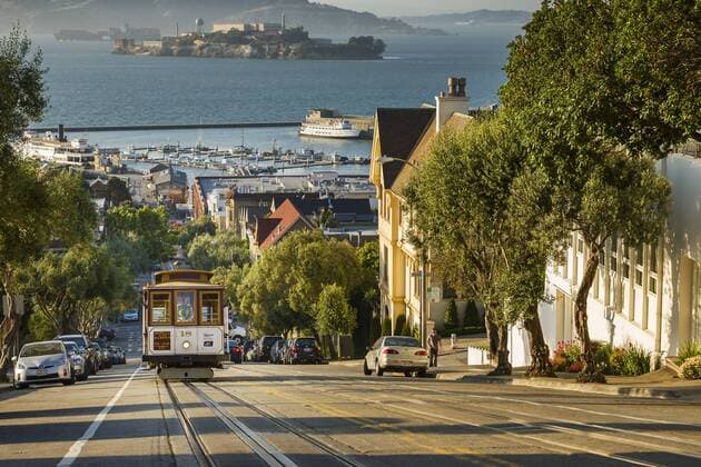 San Francisco city tram climbs up Hyde Street with Alcatraz beyond, San Francisco, California, United States of America, North America Copyright: GarryxRidsdale 1219-16